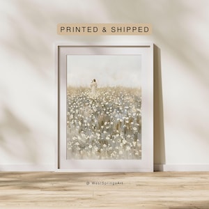May include: A framed art print featuring a serene watercolor painting. The artwork depicts a figure in a field of white flowers. The text "PRINTED & SHIPPED" is above the frame. The artist's name, "@WestSpringsArt", is at the bottom.