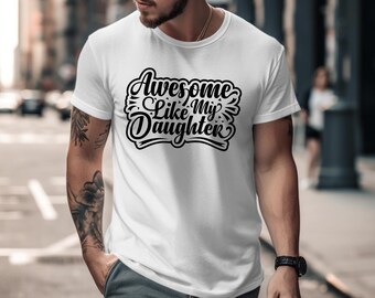May include: White t-shirt with the text "Awesome Like My Daughter" in a black, stylized font. The shirt is short-sleeved and appears to be made of cotton. The design is centered on the chest.