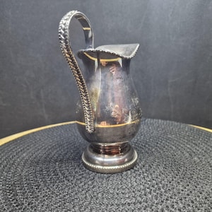 Vintage Silver Plated Creamer Pitcher - Elegant Tableware. This elegant vintage silver-plated pitcher is a versatile piece, perfect for ...