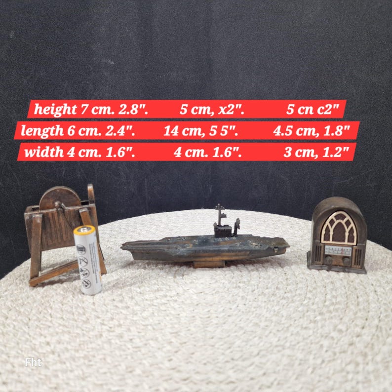 May include: A collection of miniature vintage items, including a wooden structure, a battery, a model aircraft carrier, and a radio. The aircraft carrier is 14 cm (5.5 inches) long. The height of the wooden structure is 7 cm (2.8 inches).