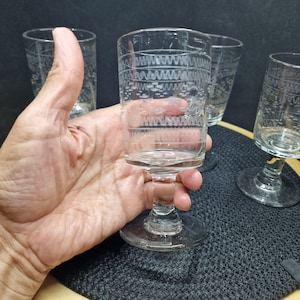 Set of 4 Vintage Wine Glasses - Etched Clear Glass. Elevate your entertaining with this elegant set of four vintage wine ...