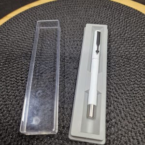 Vintage Parker 45 Pen - M Nib, Black with Gold Trim, Original Box. This elegant vintage Parker 45 fountain pen features a classic..