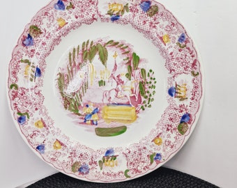 vintage P. Regout, assiette décorative Maastricht Orient 1836 avec peinture dominante rose, verte et jaune et cadres centraux cavalier