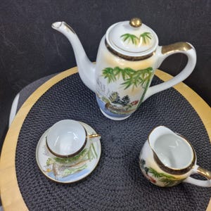 Vintage Japanese Kutani Tea Set - Bamboo Landscape, Gold Trim. This exquisite vintage Japanese Kutani porcelain tea set features delicate...