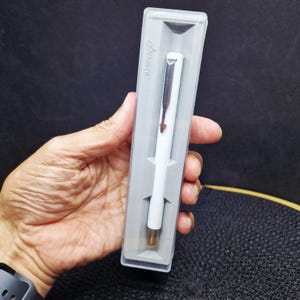 Vintage Parker 45 Pen - M Nib, Black with Gold Trim, Original Box. This elegant vintage Parker 45 fountain pen features a classic..