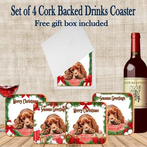 May include: Set of four cork-backed drinks coasters featuring a sleeping dog design with holiday greetings. The coasters are square with a brown border and include the text "Merry Christmas" and "Seasons Greetings". A wine bottle and a glass of red wine are also visible.