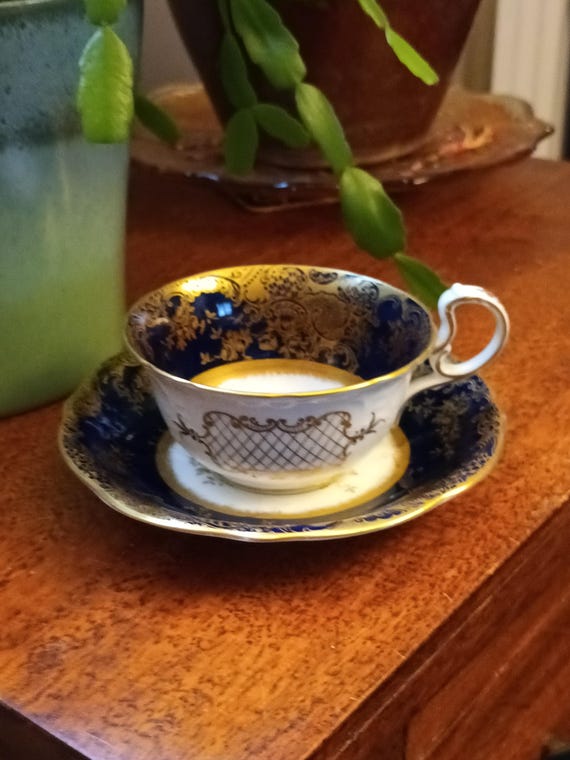 Stunning very rare  Antique Victorian John Aynsley English Fine bone China Wide rim ring handle cup and saucer .Blue gold filligree C1890s