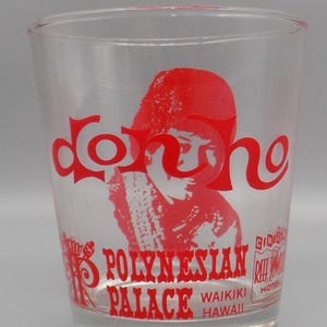 May include: Clear glass with red lettering and a red graphic of a person. The glass reads "Don Ho" and "Polynesian Palace Waikiki Hawaii". The glass also has the words "Reef Towers Hotel".