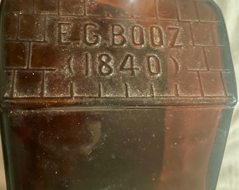 Botella de whisky E.G. Booz's Old Cabin, vidrio amatista morado, 8", 1840 Wheaton, NJ