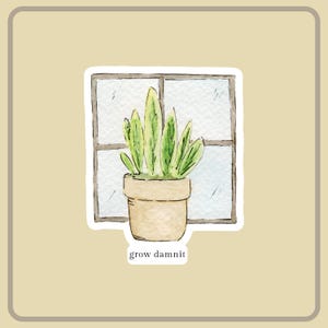 Pode incluir: Adesivo em aquarela com uma planta em vaso com folhas longas e verdes em frente a uma janela. O vaso bege está em uma janela. O texto "grow damnit" está abaixo.