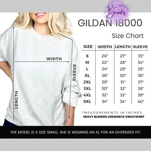 May include: A light gray Gildan 18000 heavy blended crewneck sweatshirt with a size chart. The chart shows measurements in inches for sizes S to 5XL. The model is wearing an XL for an oversized fit.