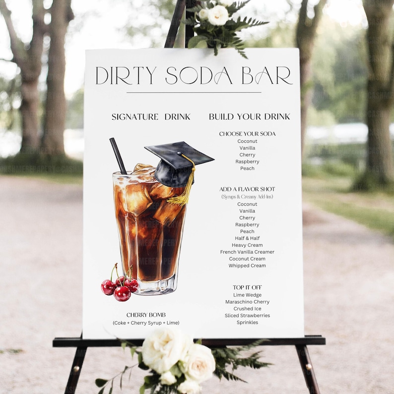 May include: A white sign with the text "DIRTY SODA BAR" and a detailed illustration of a Cherry Bomb drink. The sign lists soda and flavor options, including coconut, cherry, and raspberry. A graduation cap sits atop the drink.