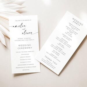 May include: Wedding ceremony program with the names Amelia and Oliver, the date Saturday, 15 June 20XX, and the location 1375 Sunset Drive, Coral Gables, FL. The program lists the order of events for the ceremony, including the prelude, processional, wedding message, exchange of vows, exchange of rings, announcement of marriage, presentation of the bride and groom, and recessional. A second card lists the wedding party, including the parents of the bride and groom, the officiant, matron of honor, bridesmaids, best man, groomsmen, ring bearer, and flower girls.