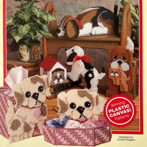 May include: A collection of plastic canvas dog-themed patterns. Includes a sleeping dog, a dog-shaped tissue box cover, a dog house, a dog with a red bow, and a dog holding a puppy. The patterns are designed by Carole Rodgers.