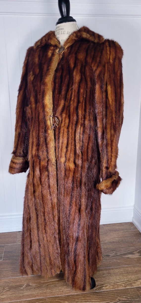 Long 2 toned mink coat.