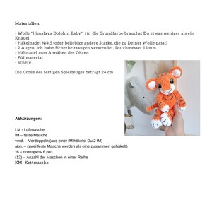 May include: A crochet tiger amigurumi pattern with instructions for making a stuffed toy. The pattern includes abbreviations for crochet stitches, such as LM for "luftmasche" (German for "loop stitch") and fM for "feste Masche" (German for "single crochet"). The pattern also includes the size of the finished toy, which is 24 cm.