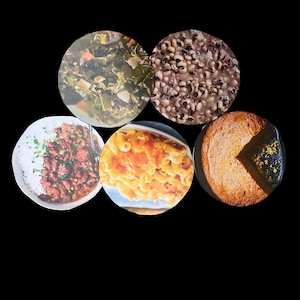 May include: A collection of six dishes of Southern comfort food, including collard greens, black-eyed peas, macaroni and cheese, red beans and rice, and cornbread.