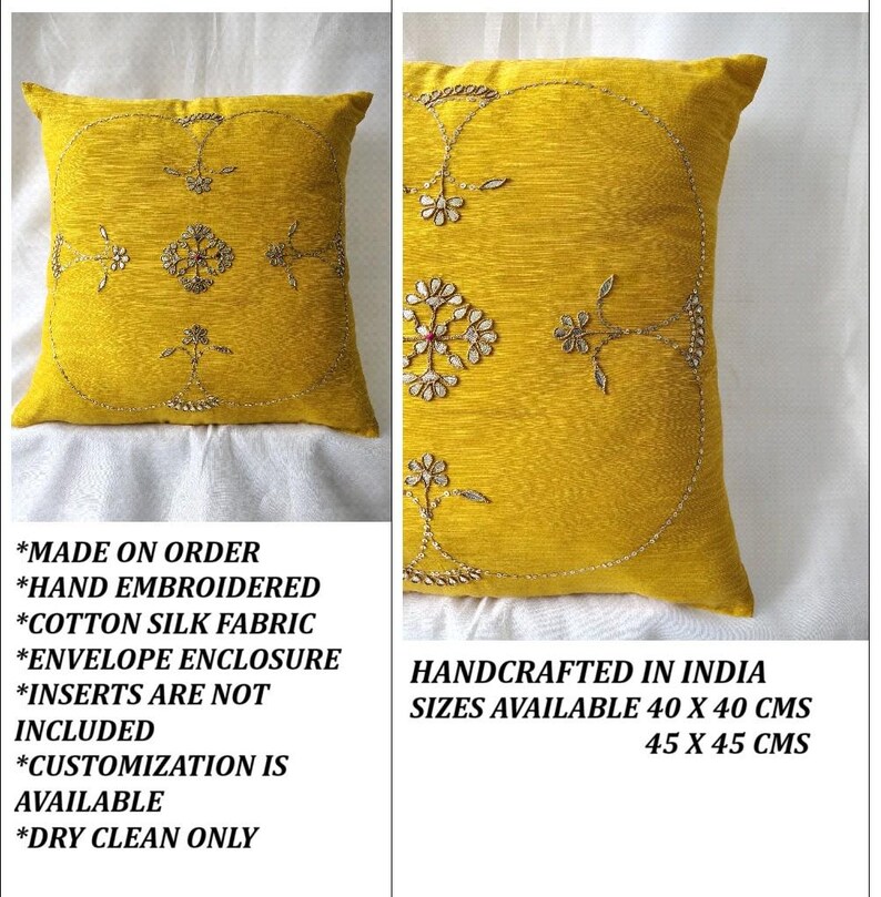 May include: A square, yellow decorative pillow with hand-embroidered floral designs. The pillow is made of cotton silk fabric and has an envelope enclosure. Available sizes are 40 x 40 cm and 45 x 45 cm.