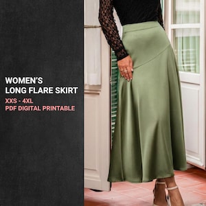 May include: A long, olive green flare skirt. The skirt is made of a smooth, flowing fabric and has a subtle sheen. The text on the left side of the image reads: "WOMEN'S LONG FLARE SKIRT XXS - 4XL PDF DIGITAL PRINTABLE."