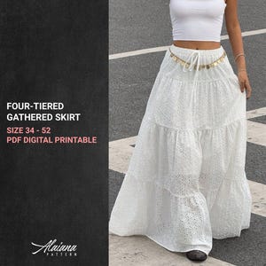 May include: A white, four-tiered gathered skirt with eyelet detailing. The skirt is long and flowing, with a drawstring waist. Text on the left reads: "FOUR-TIERED GATHERED SKIRT SIZE 34 - 52 PDF DIGITAL PRINTABLE".