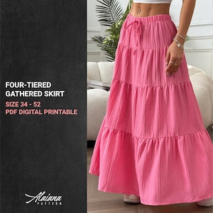 Puede incluir: Una falda rosa brillante, fruncida de cuatro niveles. La falda tiene una cintura con cordón y un diseño plisado. El texto a la izquierda dice "FOUR-TIERED GATHERED SKIRT SIZE 34 - 52 PDF DIGITAL PRINTABLE".