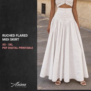 May include: A white high-waisted midi skirt featuring a vertical row of buttons down the center front, a fitted waistband, and a flared, pleated silhouette. The text on the left reads RUCHED FLARED MIDI SKIRT, XS - 3XL, PDF DIGITAL PRINTABLE.