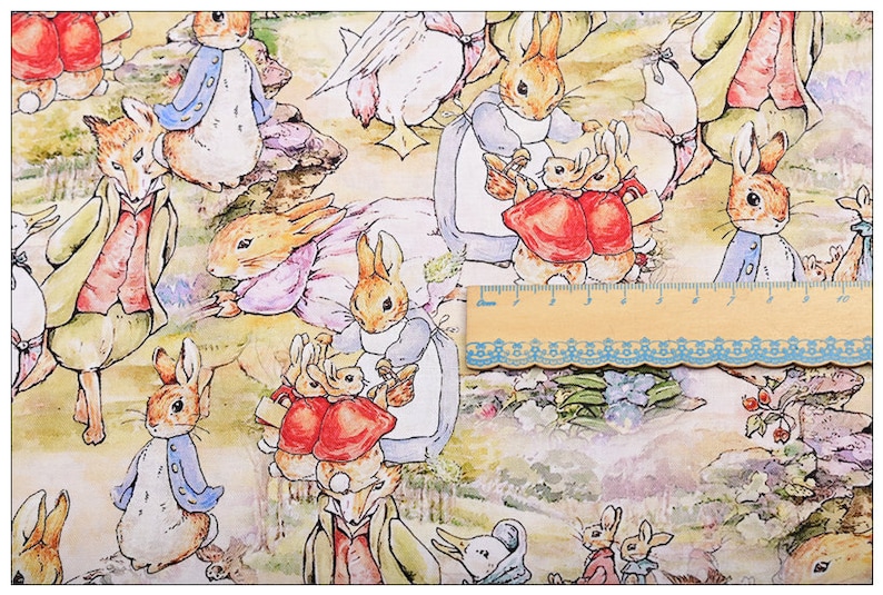 May include: A colorful fabric with a repeating pattern of rabbits and ducks. The rabbits are wearing clothes and some are holding baskets. The background is a light yellow with green and blue accents.
