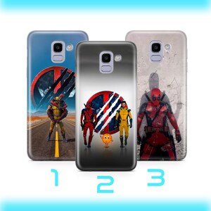 May include: Three phone cases with different superhero designs. The first case features a red and black superhero with a claw mark on the chest. The second case features a red and black superhero with a claw mark on the chest and a yellow superhero with a claw mark on the chest. The third case features a red and black superhero with a claw mark on the chest.