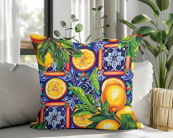 May include: A square cushion featuring a colourful pattern of oranges, orange slices, and green leaves set against a dark blue backdrop. The design incorporates floral and geometric motifs, ideal for home decor, measuring approximately 40cm x 40cm.