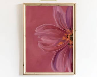 May include: Framed floral art print featuring a close-up of a pink and purple flower against a solid pink background. The flower's petals are detailed with varying shades of pink and purple. The frame is a light wood color, and the text "ChicGlow" is in the top center.
