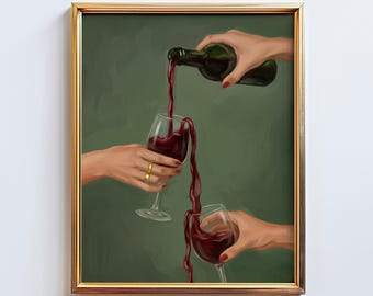 May include: A framed art print showing a bottle pouring red wine into two wine glasses. The hands holding the bottle and glasses are visible. The artwork has a gold frame and a green background.