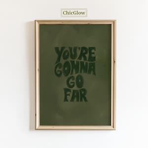 May include: Framed art print with the text "YOU'RE GONNA GO FAR" in dark green lettering on a green background. The frame is a light wood color, and the ChicGlow logo is in the top corner.
