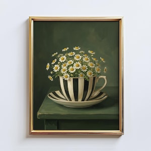 May include: A framed print of a still life featuring a teacup and saucer filled with daisies. The teacup and saucer have black and white stripes. The background is a dark green color, and the frame is gold.