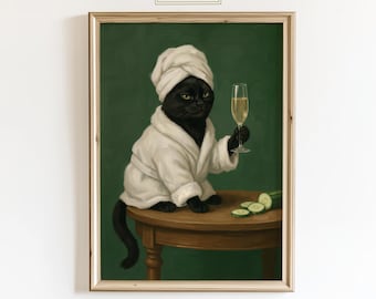 May include: A framed print depicting a black cat in a white robe and towel, holding a champagne glass. The cat is seated at a small table with cucumber slices, set against a green background. The text "ChicGlow" is at the top.