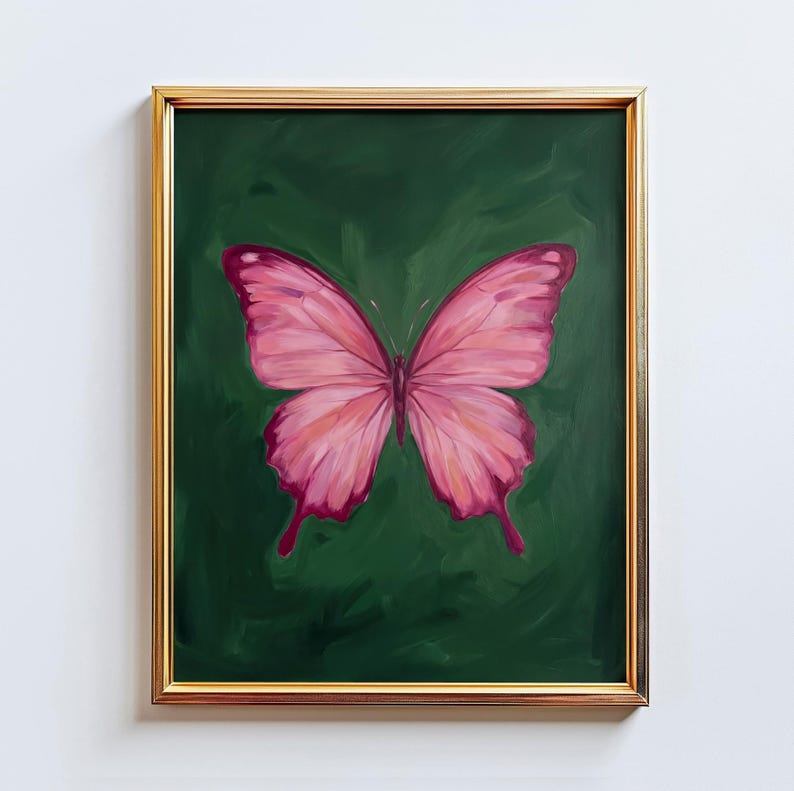 May include: A framed painting featuring a pink butterfly against a dark green background. The butterfly has detailed wing patterns with shades of pink and red. The frame is gold-colored, adding a touch of elegance to the artwork.