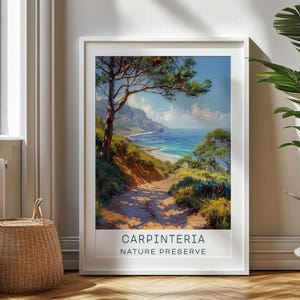 May include: A vintage-style poster with a scenic view of a coastal path leading to a beach. The poster features a blue sky, a bright blue ocean, and a lush green forest. The text on the poster reads "Carpinteria Nature Preserve".