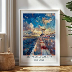 May include: Framed art print of the Silverstone Circuit in England. The artwork features an impressionistic painting of the racetrack with a blue sky filled with clouds. The text "SILVERSTONE CIRCUIT ENGLAND" is at the bottom.