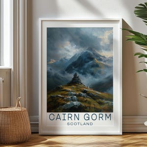 May include: A vintage travel poster featuring a scenic view of Cairn Gorm in Scotland. The poster has a blue and white color scheme with a mountain range in the background and a stone cairn in the foreground. The text "Cairn Gorm" and "Scotland" is printed in blue at the bottom of the poster.
