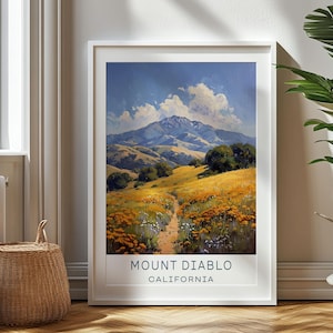 May include: A vintage-style travel poster featuring a scenic view of Mount Diablo in California. The poster depicts a mountain range with a winding path leading through a field of yellow wildflowers. The sky is blue with fluffy white clouds.