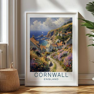 May include: A vintage travel poster featuring a picturesque coastal village in Cornwall, England. The poster depicts a quaint village nestled on a hillside overlooking a blue ocean with a sailboat in the distance. The village is surrounded by lush greenery and colorful flowers.