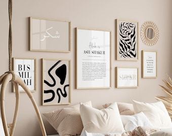 May include: A bedroom interior with a bed, pillows, and a hanging chair. The wall is decorated with black and white abstract art prints, including a print with the text "Allah is Ash Shakur - The Most Appreciative".