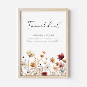 May include: A framed art print with the word "Tawakkul" in elegant script. The print features an English translation of a religious verse, floral illustrations in the lower section, and a light wood frame.