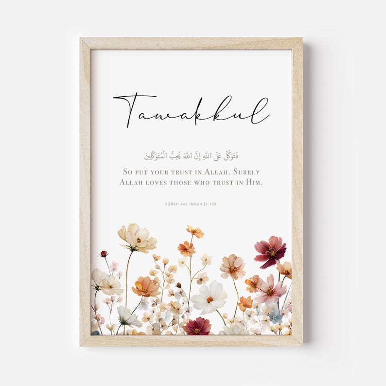May include: A framed art print with the word "Tawakkul" in elegant script. The print features an English translation of a religious verse, floral illustrations in the lower section, and a light wood frame.