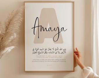 May include: A beige and white printable wall art print with the name "Amaya" in black script and an Arabic inscription. The inscription translates to "In the Name of Allah, with whose Name nothing can harm in the earth nor in the sky. He is The All-Hearing and All-Knowing."