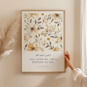 May include: A framed print with a floral design in shades of beige and brown. The print features an Arabic quote that translates to "Call upon me, I will respond to you." The quote is from the Quran, chapter 40, verse 60.