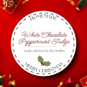 May include: A round white label with the words "HOMEMADE" and "MERRY CHRISTMAS" in black. The label reads "White Chocolate Peppermint Fudge" in a decorative font, with "made with love by the Smiths" below. A red background.
