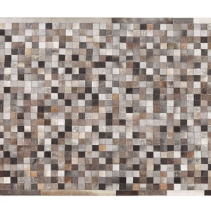 May include: A patchwork rug made of small squares of leather in various shades of brown, gray, and white.