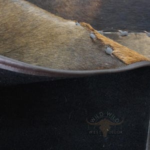 Durable non slip backing and strongly stitched leather edges on cowhide rug