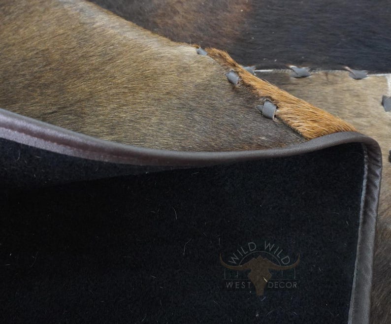 Durable non slip backing and strongly stitched leather edges on cowhide rug