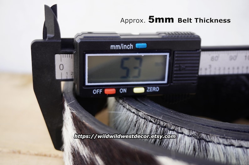 May include: A rustic wooden sign with the text "Welcome to our home" in white lettering. The sign features a distressed finish and a simple, inviting design, perfect for entryway decor.